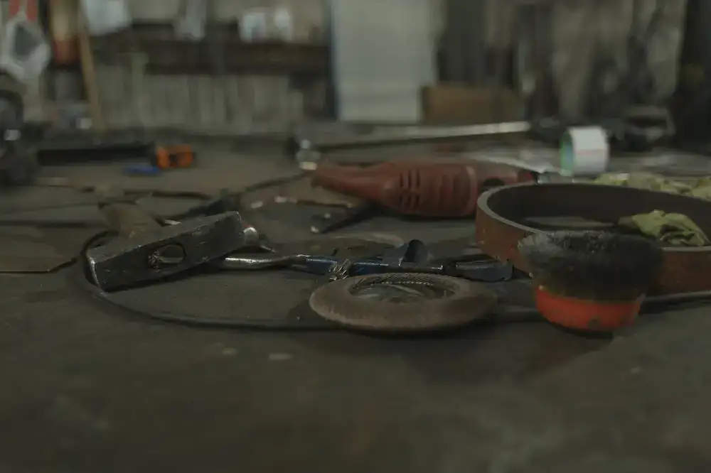 Various glassblowing tools resting on a workbench